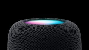 Apple’s new HomePod device with smart displays and AI may be landing next year. Top of Black HomePod device seen with multicolored light