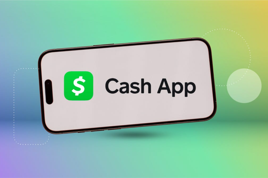 the Cash App logo on a smart phone in front of a blue, green and yellow multihued background