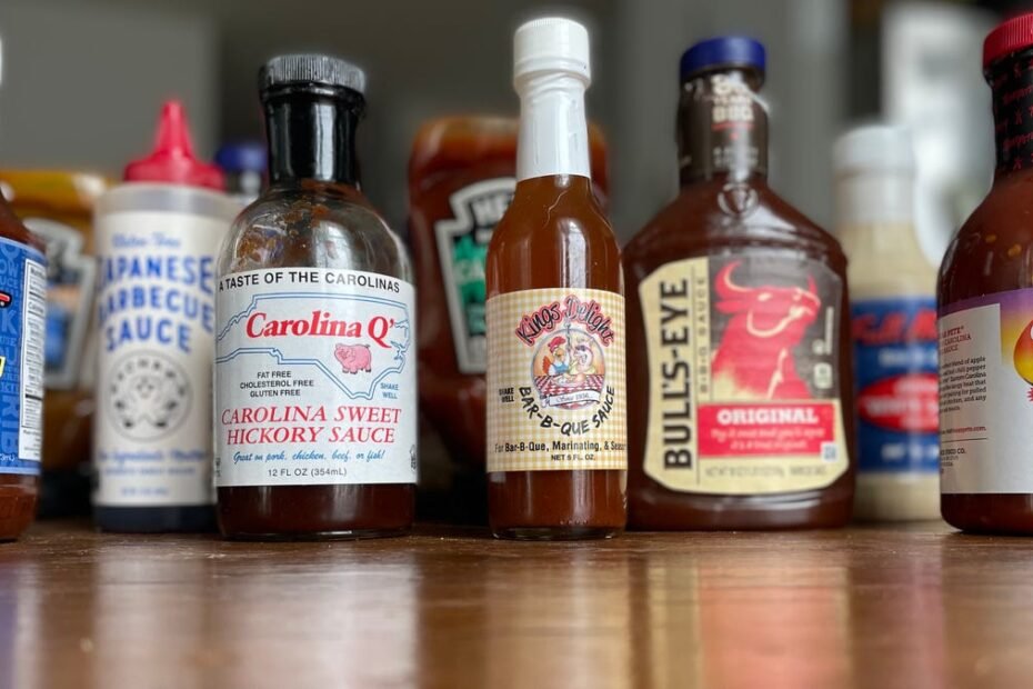 Several brands of barbecue sauce on a counter